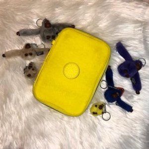 Yellow Kipling pencil case with 6 monkeys